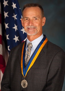 Mark E. Johnson